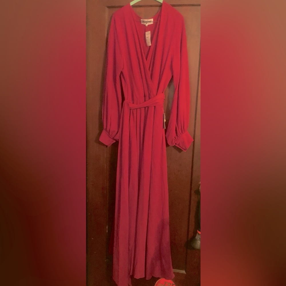 Elegant fuchsia long-sleeve dress.